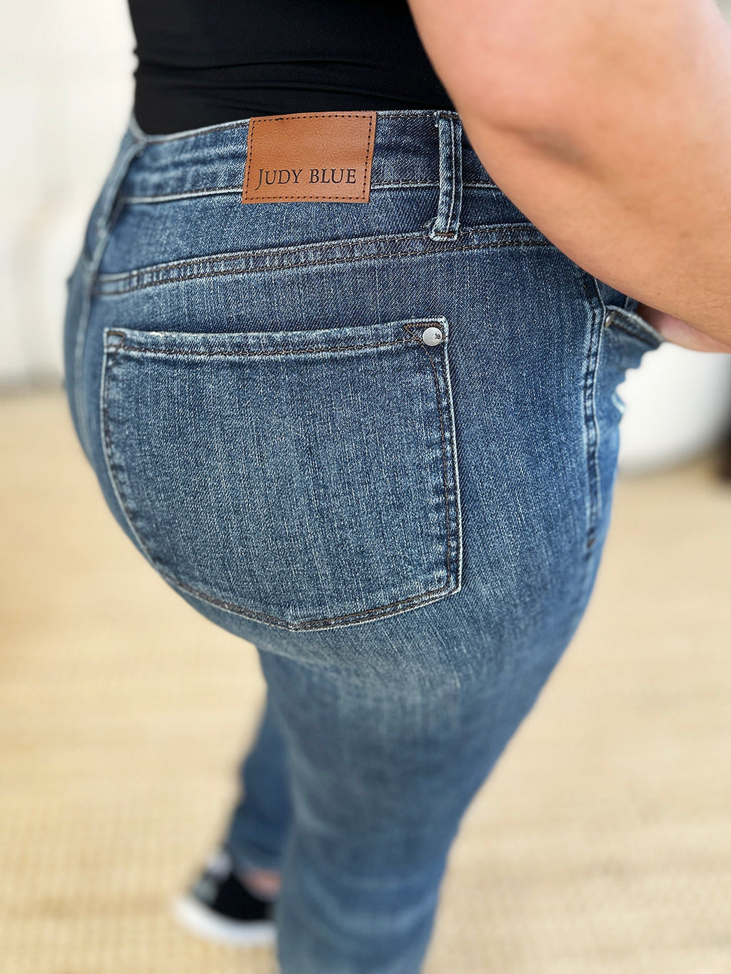 Judy Blue Full Size Mid Waist Distressed Slim Jeans by Wild and Free Boutique