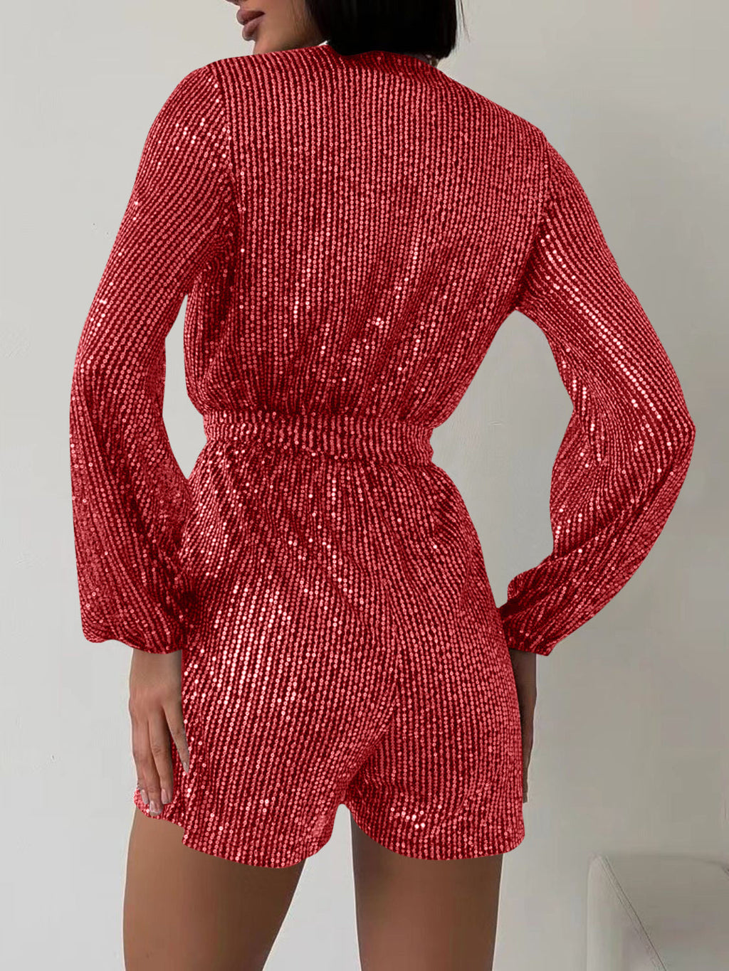Full Size Sequin Surplice Tie Waist Long Sleeve Romper by Wild and Free Boutique