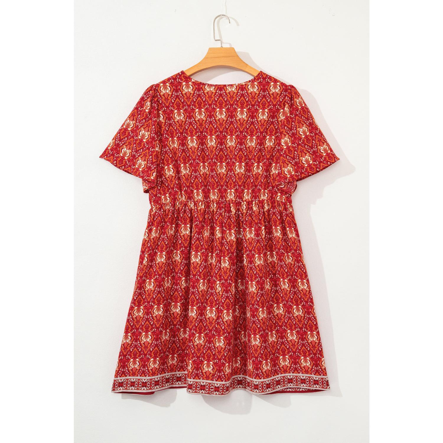 Orange Plus Size Printed Surplice Neck Empire Waist Flowy Mini Dress by Wild and Free Boutique
