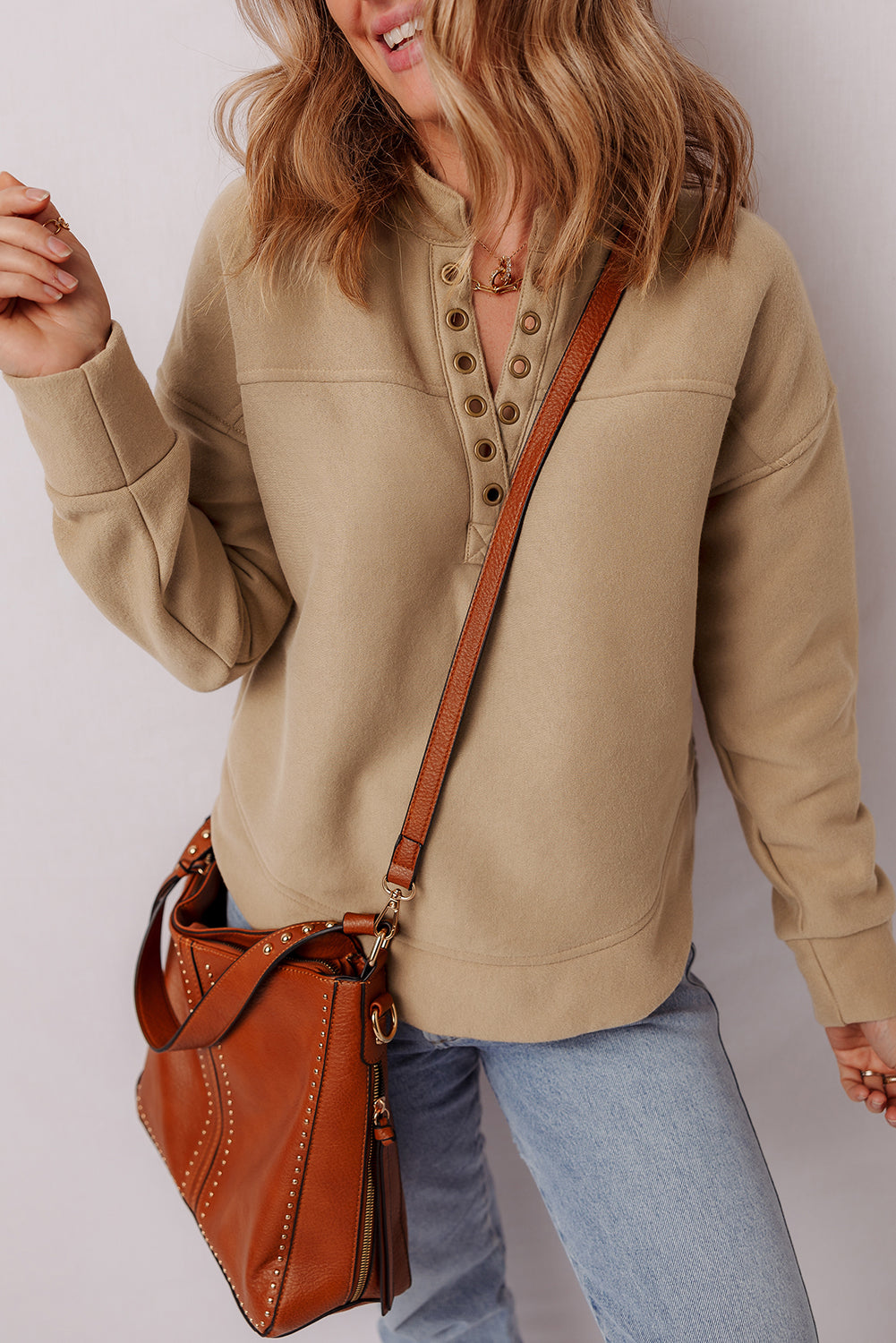 Elina French Grommet Detail Sweatshirt by Threaded Pear