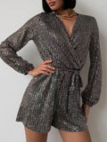 Full Size Sequin Surplice Tie Waist Long Sleeve Romper by Wild and Free Boutique