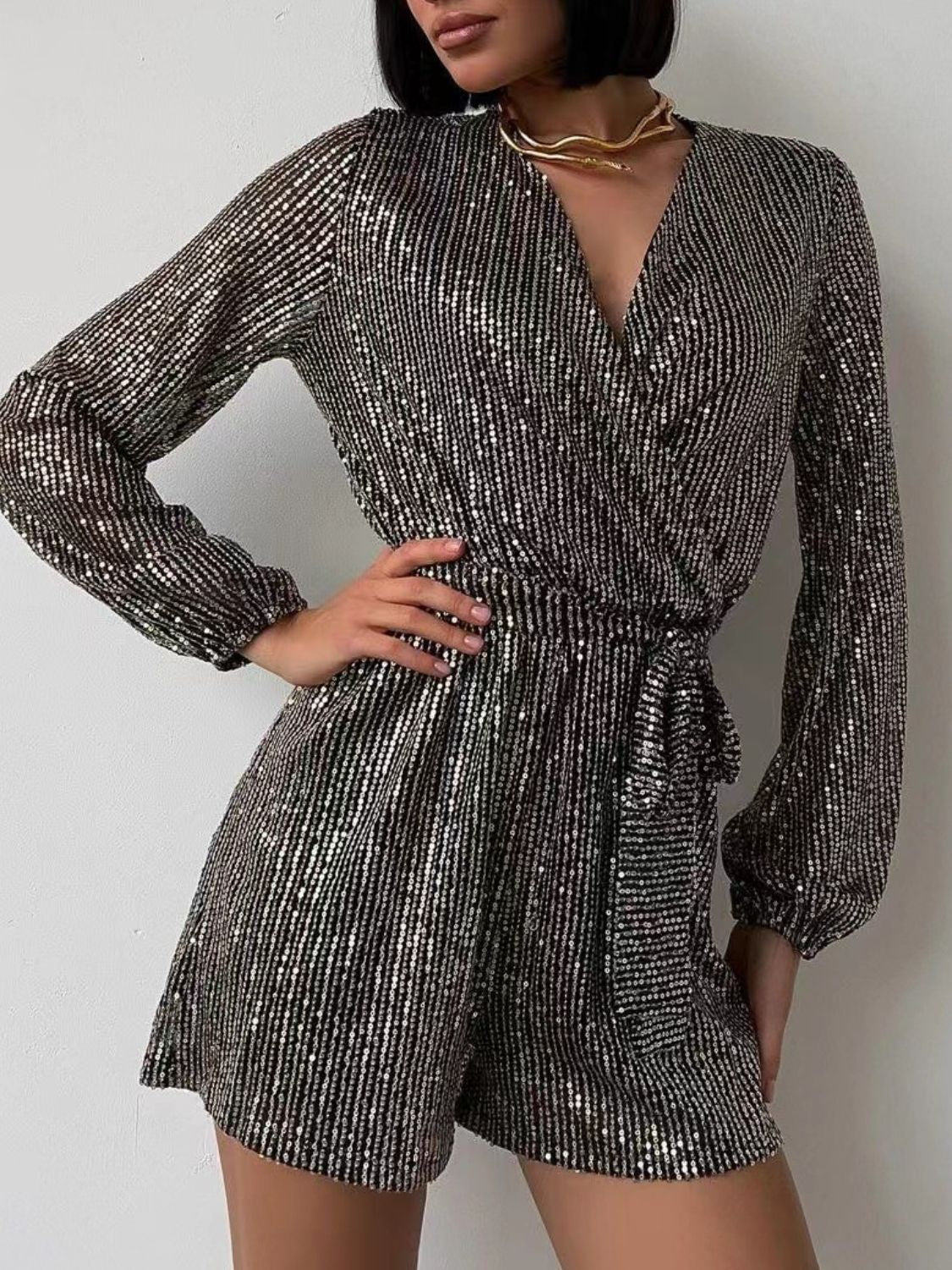 Full Size Sequin Surplice Tie Waist Long Sleeve Romper by Wild and Free Boutique
