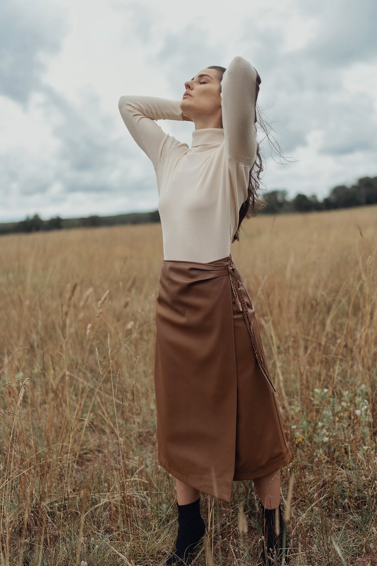 LEATHER FAUX WRAP SKIRT by profile-nyc