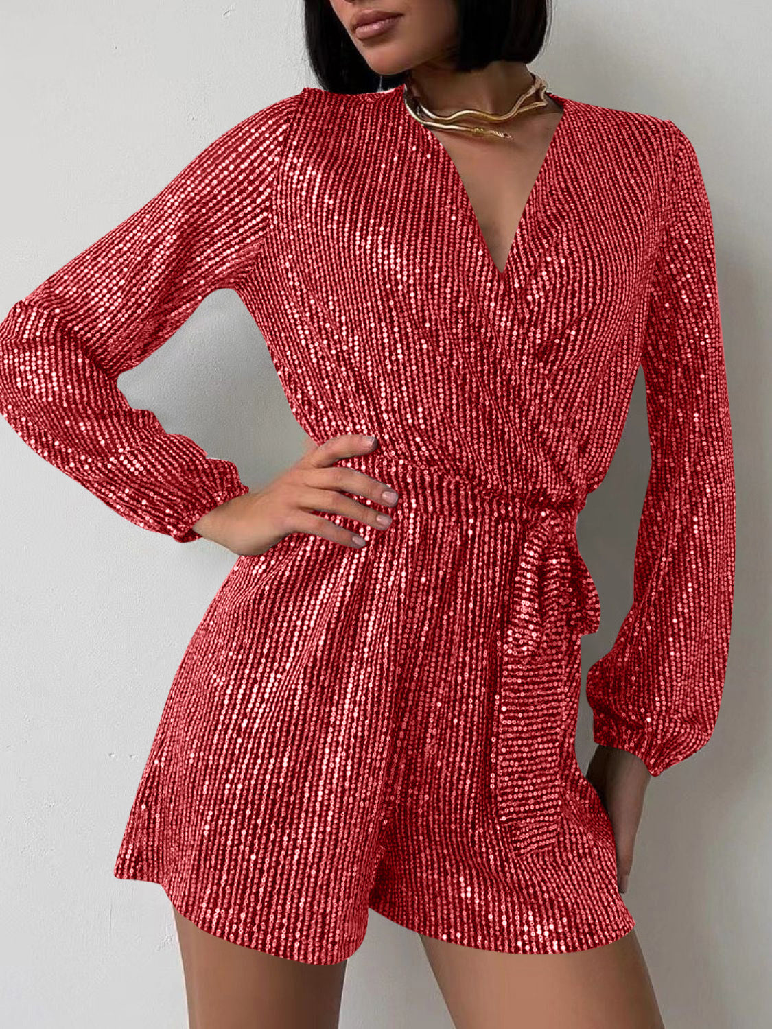 Full Size Sequin Surplice Tie Waist Long Sleeve Romper by Wild and Free Boutique
