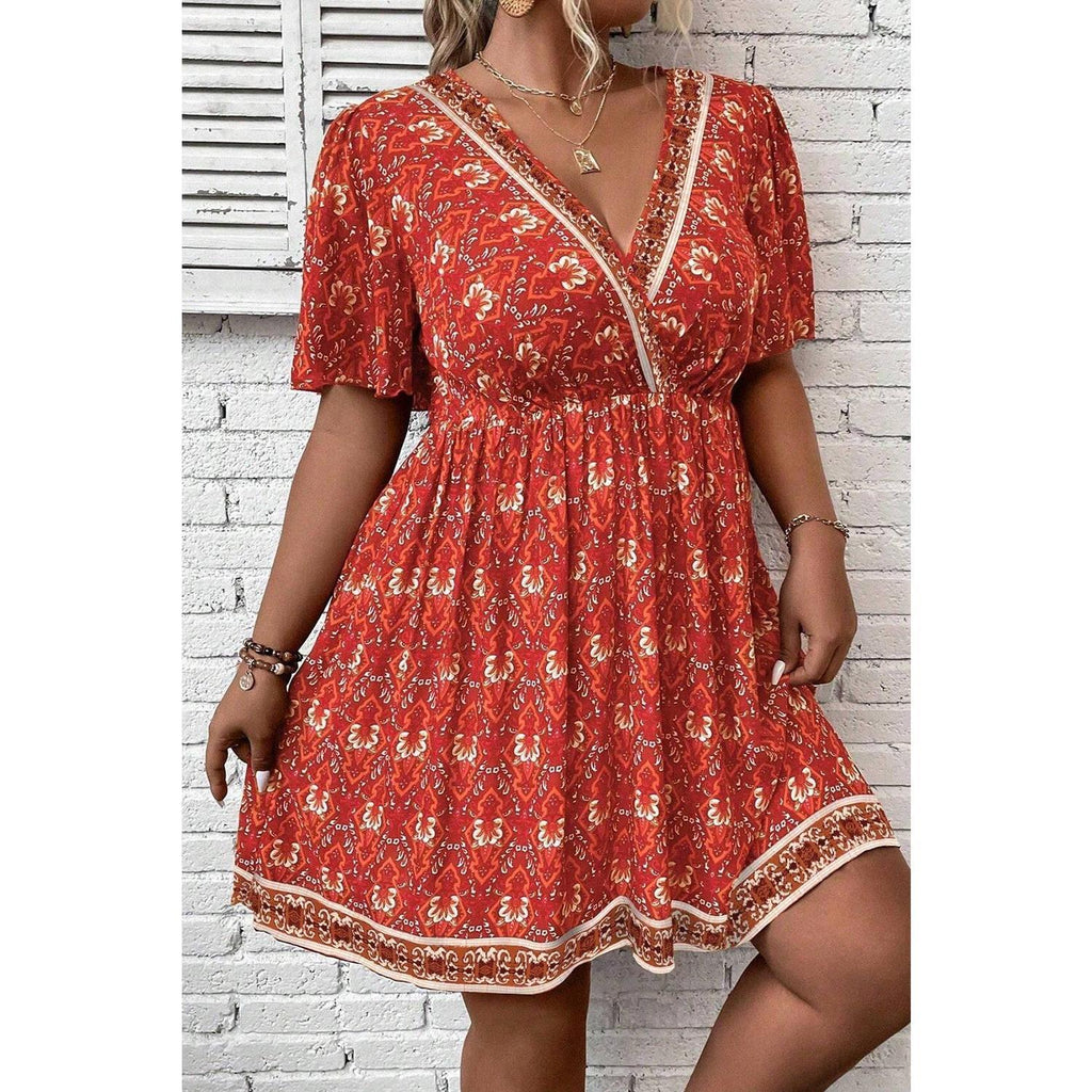Orange Plus Size Printed Surplice Neck Empire Waist Flowy Mini Dress by Wild and Free Boutique