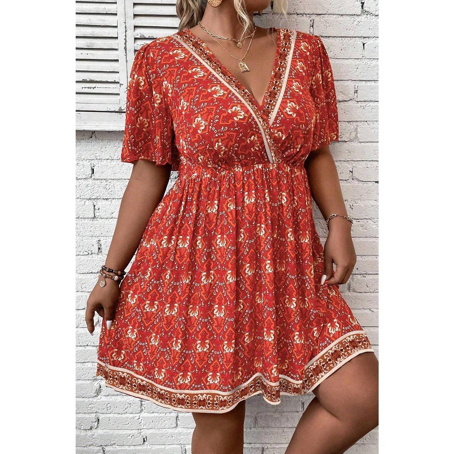 Orange Plus Size Printed Surplice Neck Empire Waist Flowy Mini Dress by Wild and Free Boutique