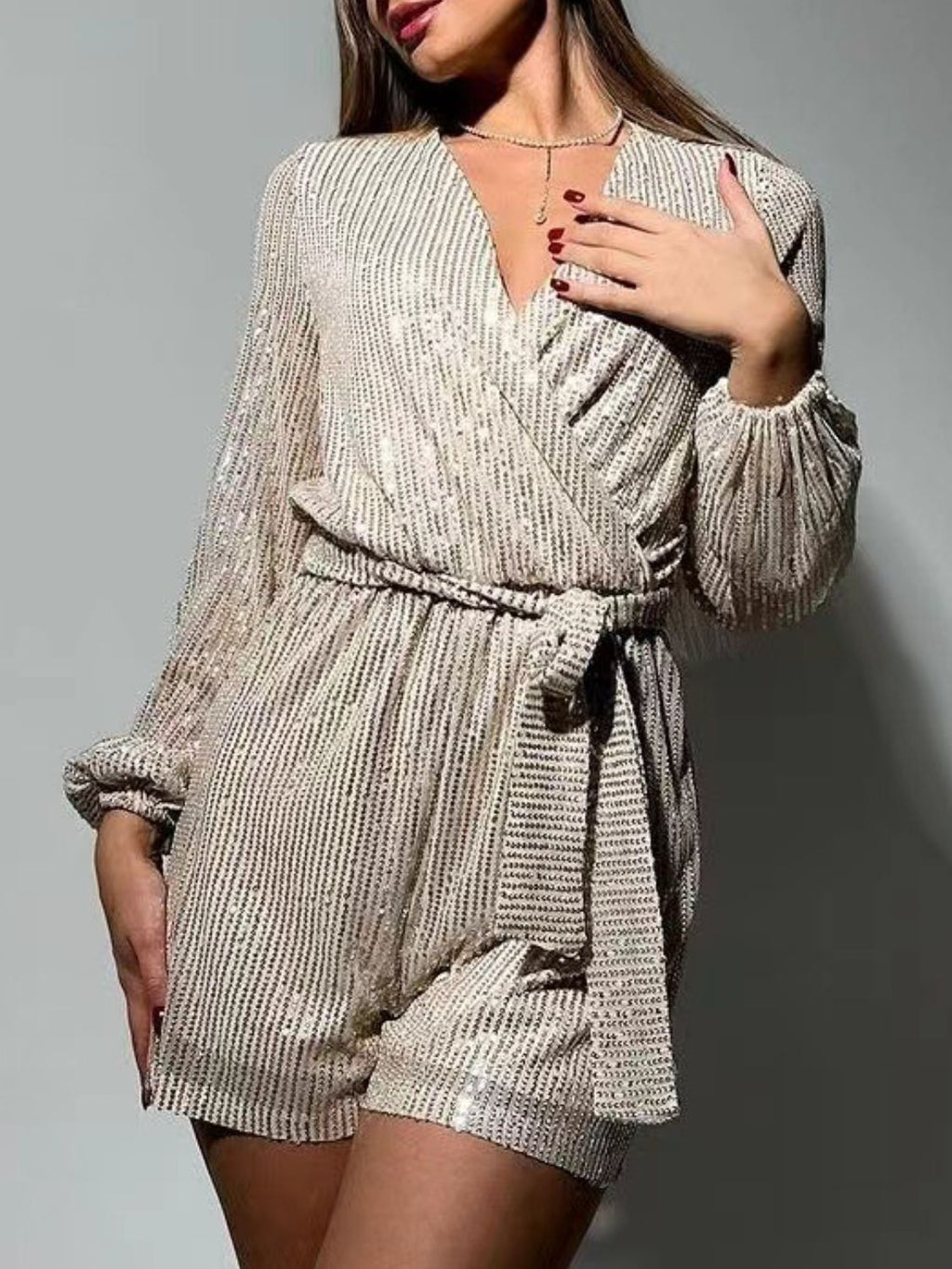 Full Size Sequin Surplice Tie Waist Long Sleeve Romper by Wild and Free Boutique