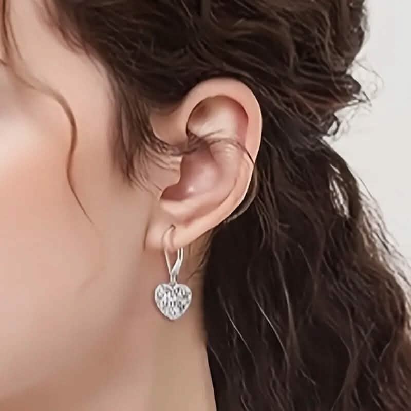 Exquisite Hollow Heart-Shaped Hoop Earrings by DailySale