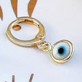Glass Evil Eye Huggie Earrings by Classic Variable